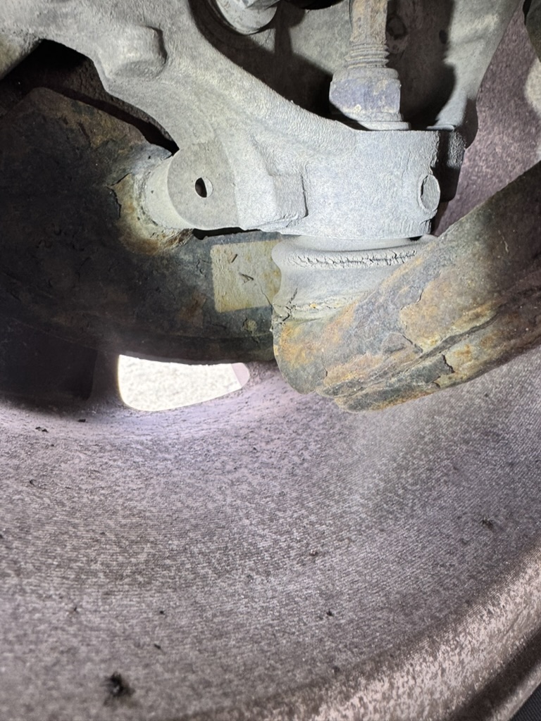 Inspection of a worn ball joint and control arm