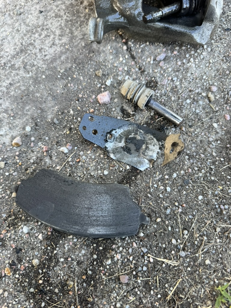 Damaged brake pad removed during service