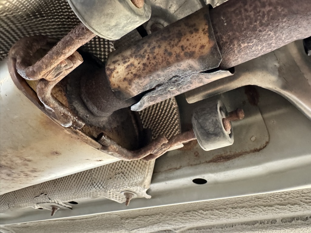 Close-up of exhaust system repair