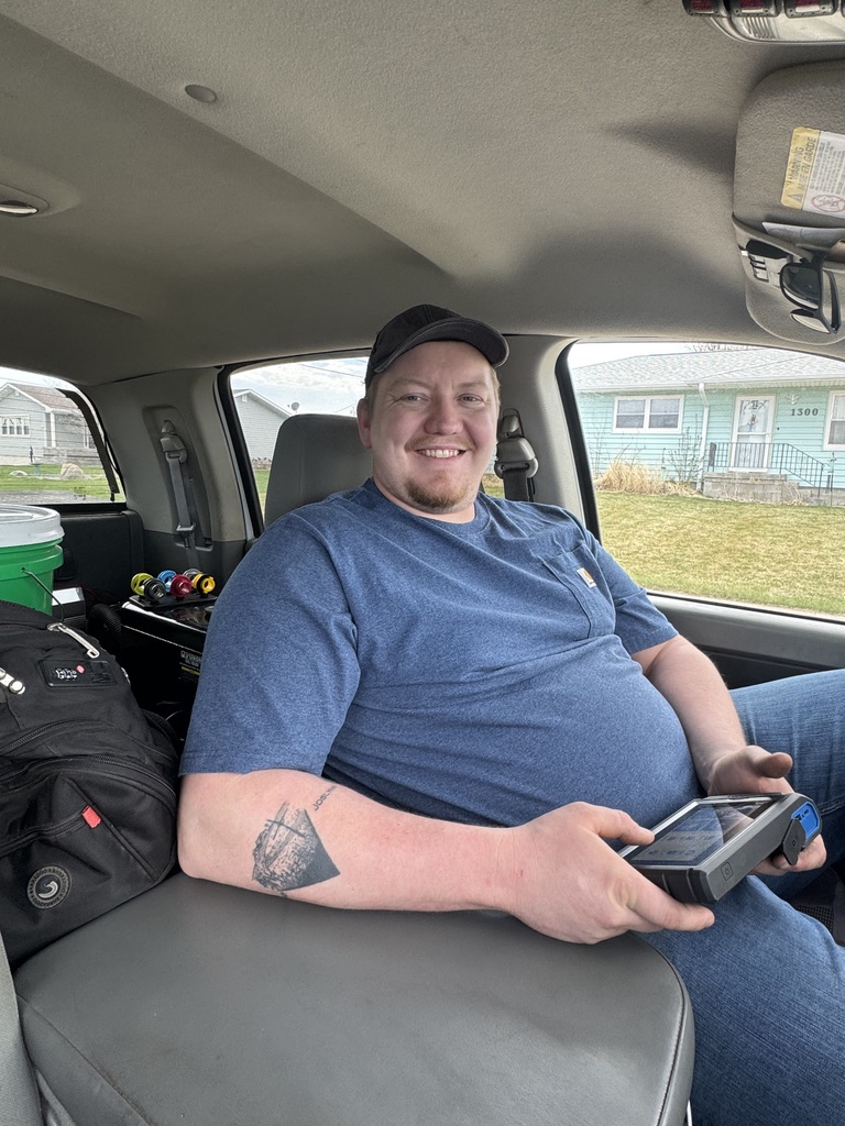 BC Mobile Mechanics owner with diagnostic tool in service truck